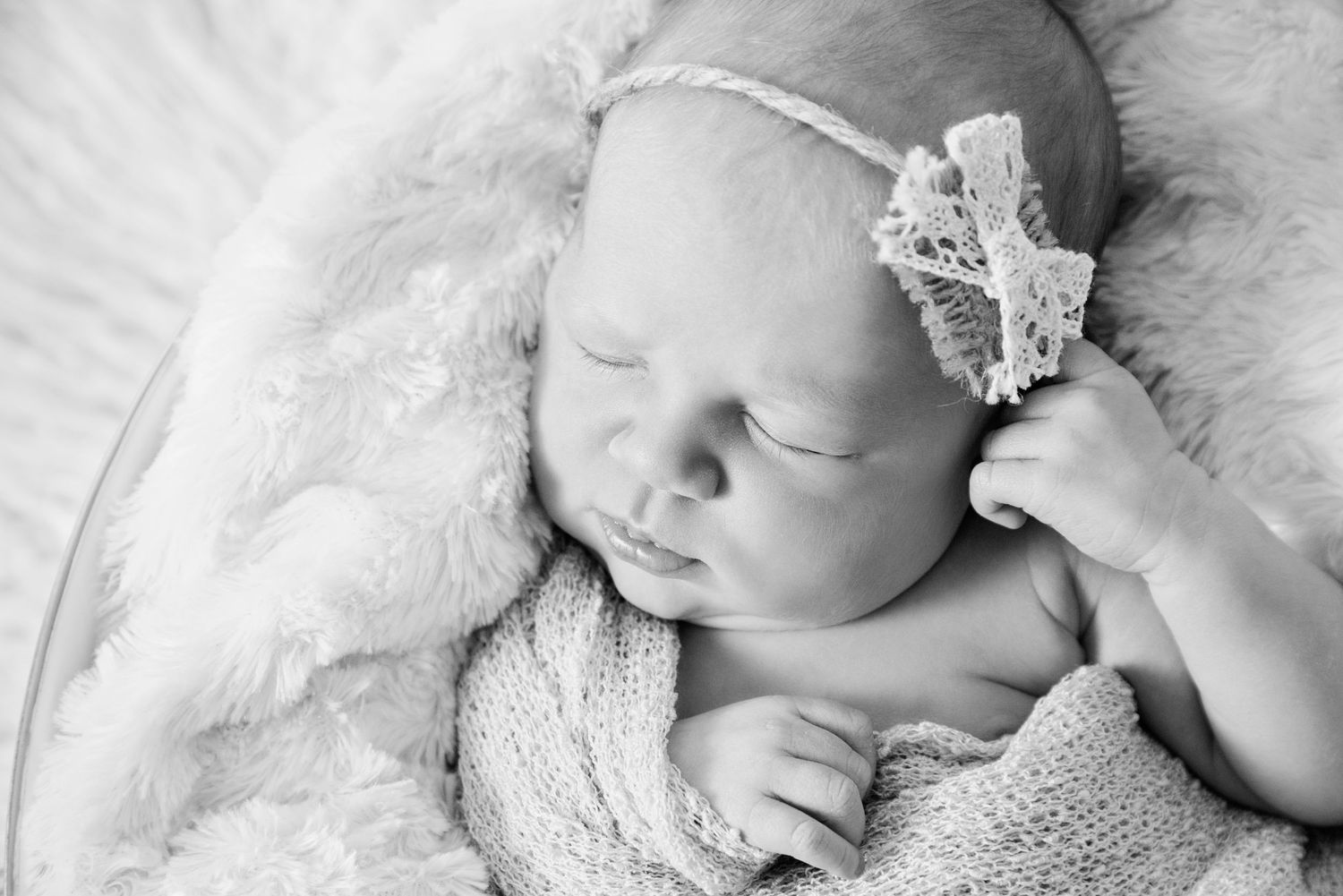 a black and white image of a sleeping baby girl for her photoshoot on the Gold Coast