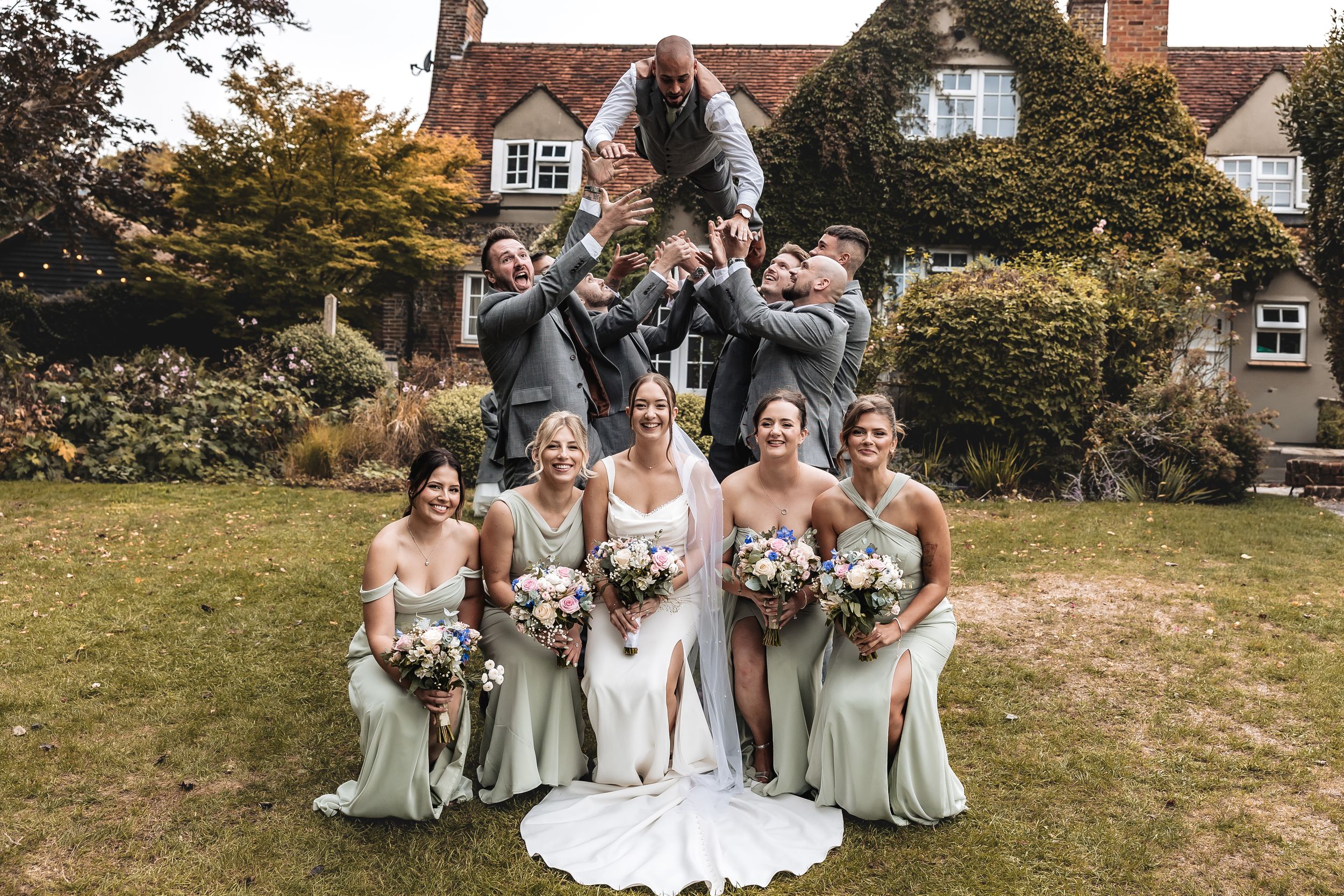 Fun bride and groom photo outside their wedding venue
