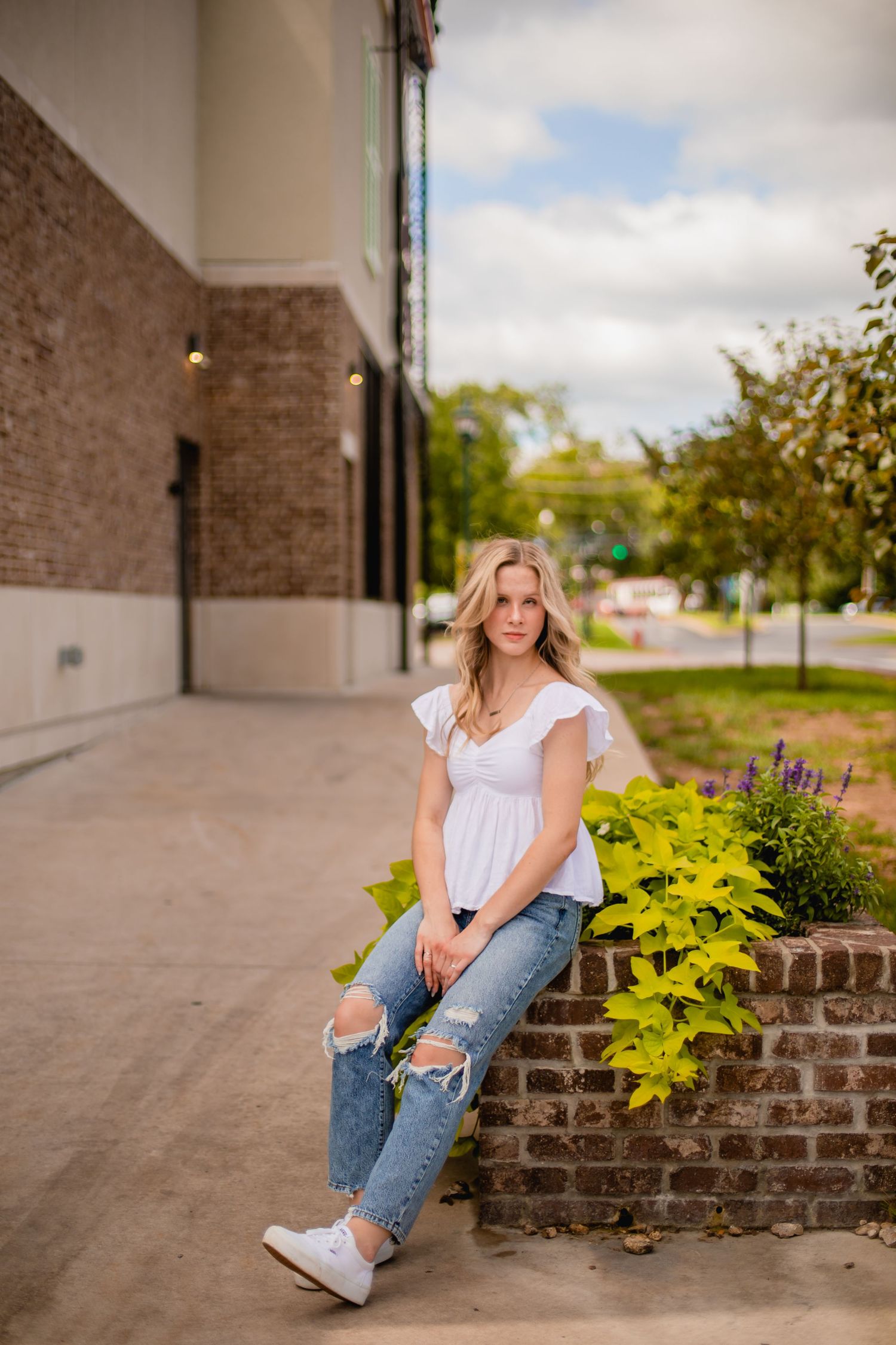 senior poses for morgan lea photography at the Branson Landing