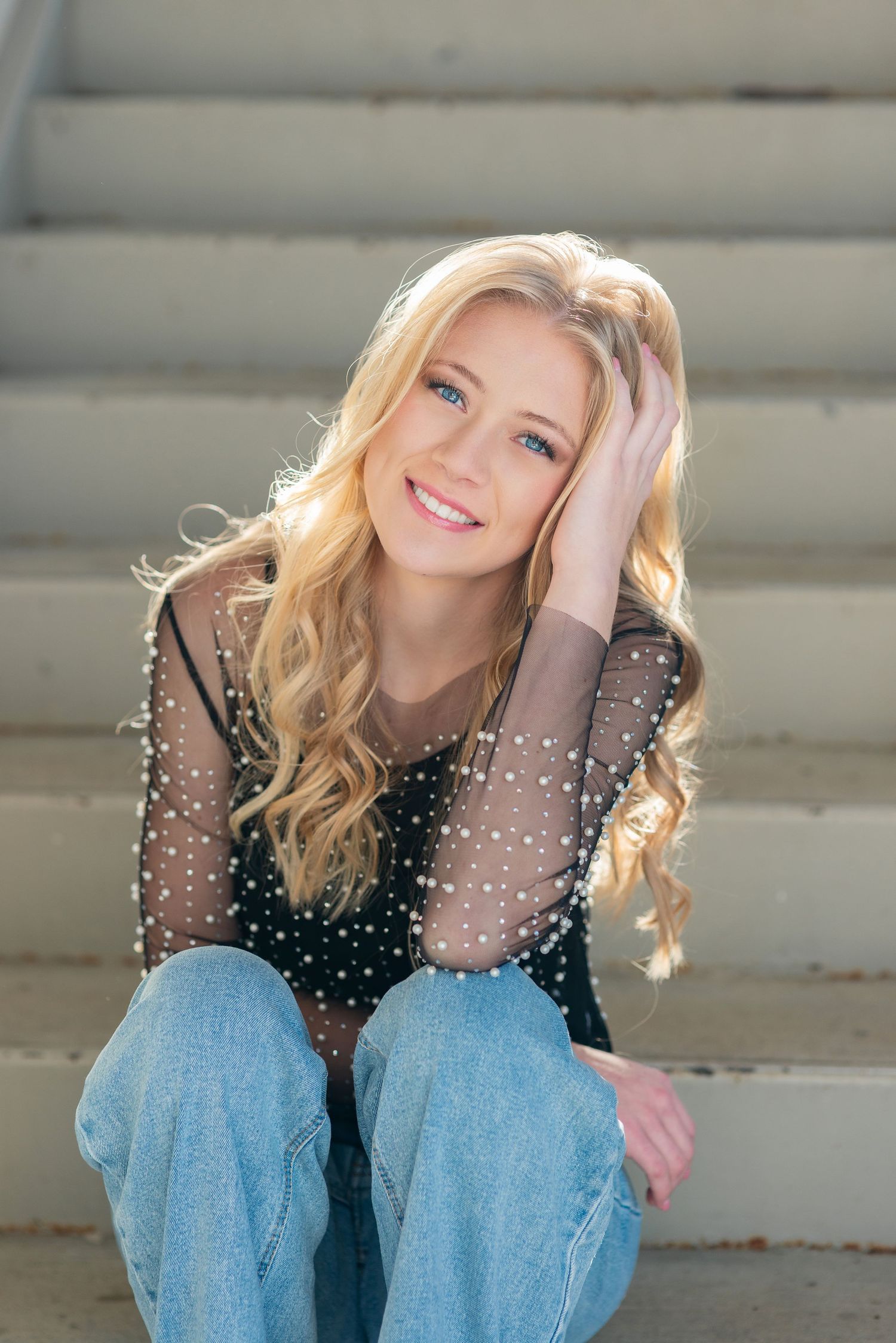 High school senior girl portrait sitting on steps