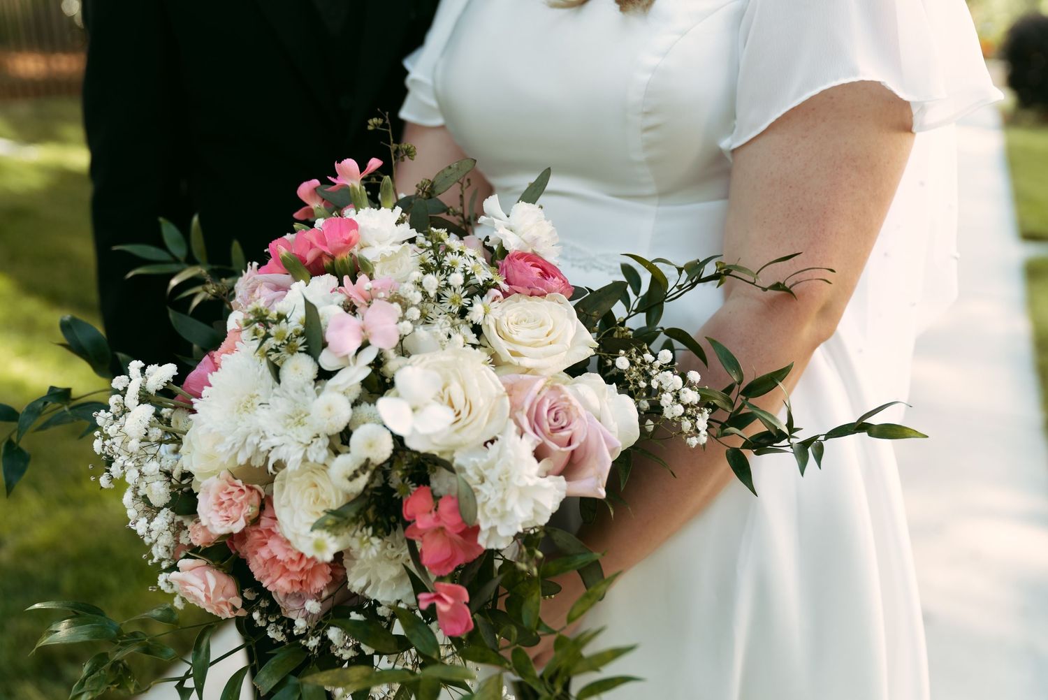 Rand Bryan House Photo of Wedding Couple holding bouquet
