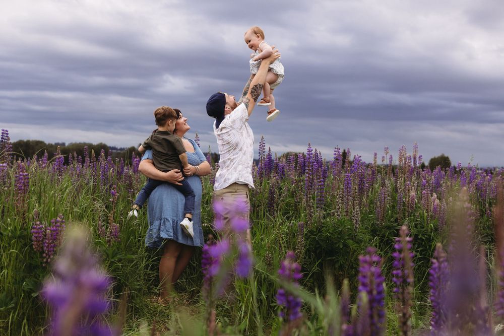 Playful family photo session in lupine field Puyallup, Washington
