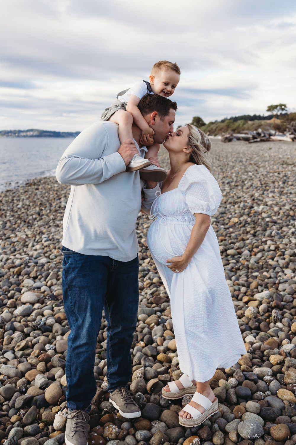 Maternity family photos with young kid at Chambers Bay in University Place, Washington