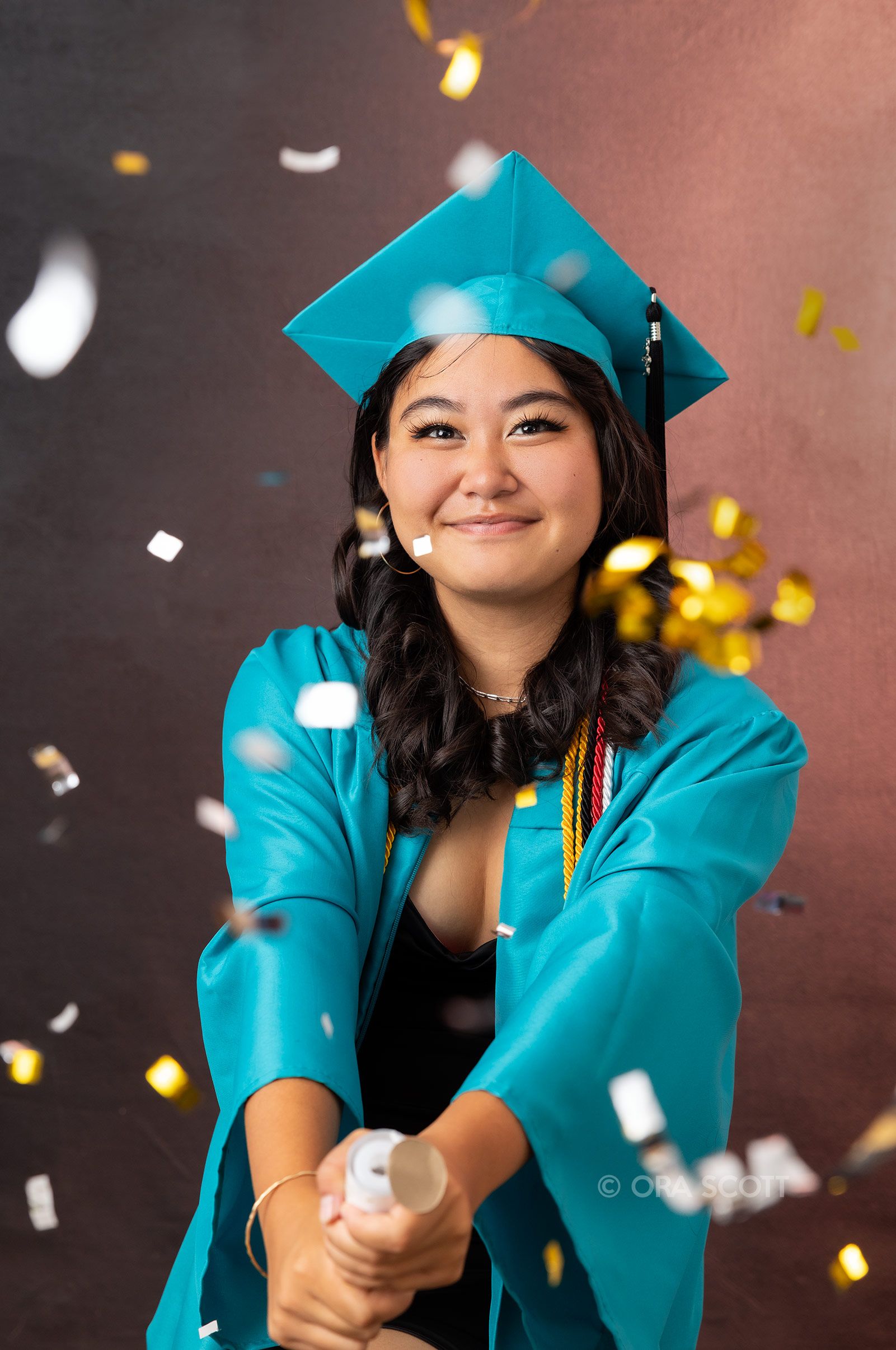 King Kekaulike high school senior with popper to celebrate her recent graduation