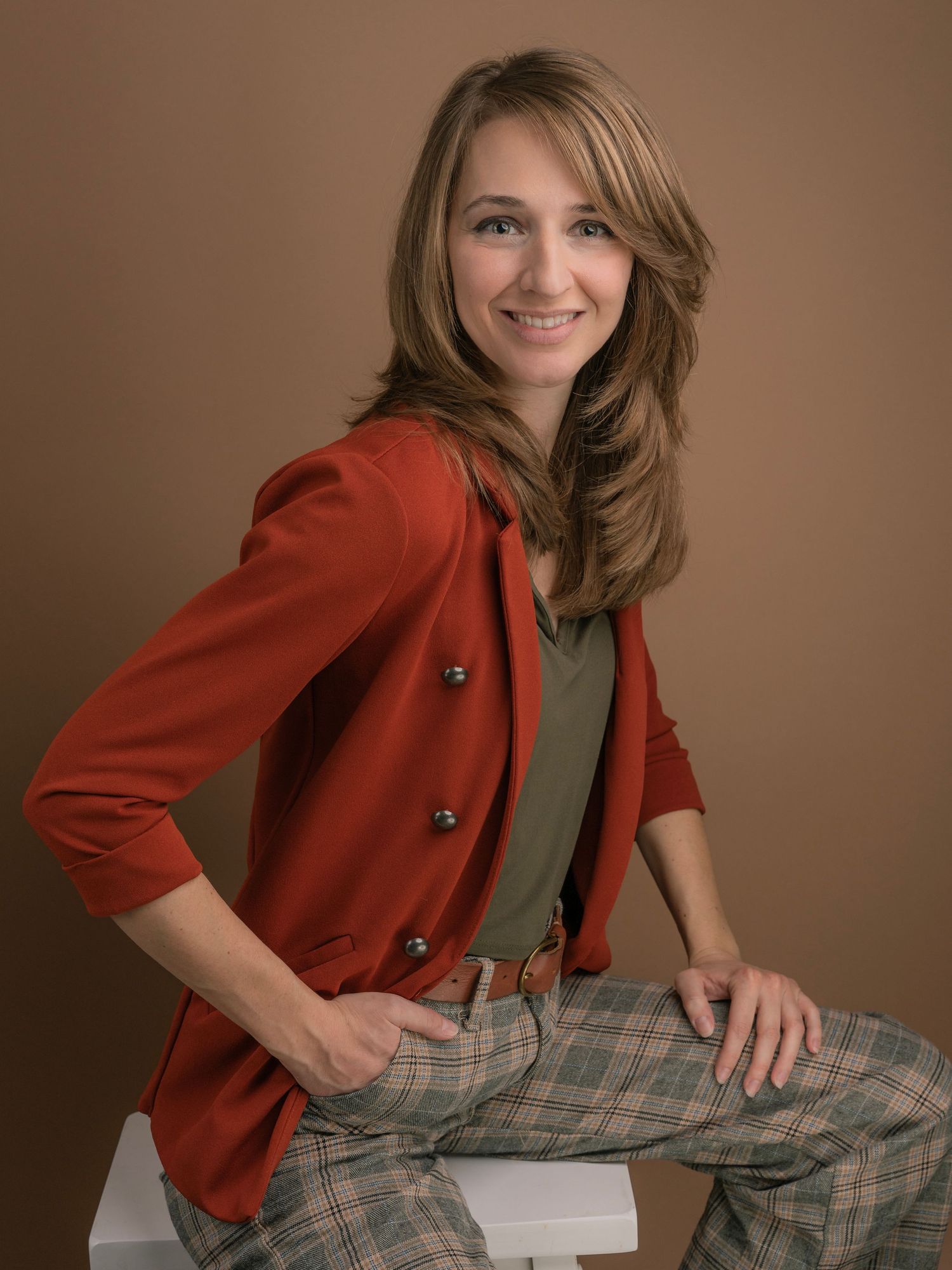 Young professional woman posing for branding photography session in a studio in Dandridge Tennessee