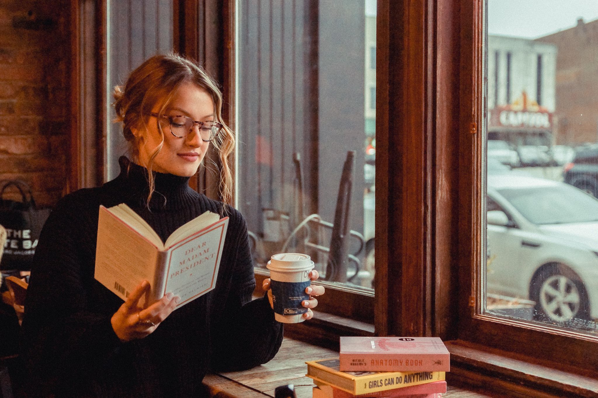 Storytelling photo of a woman studying in a local downtown coffee shop in Bowling Green, Kentucky at Spencers