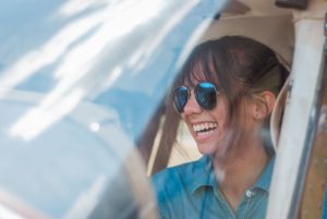 Travel photograph of a female pilot in plane in Charlotte, North Carolina