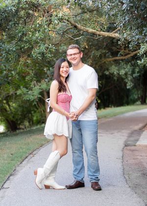 A couple shares intimate moments on a tree-lined pathway in a series of romantic poses.
