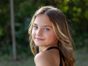 Close up portrait with natural lighting and soft bokeh background.