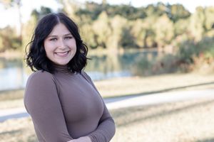 A series of outdoor portrait photos showing someone in a brown turtleneck sweater against a sunny natural backdrop.