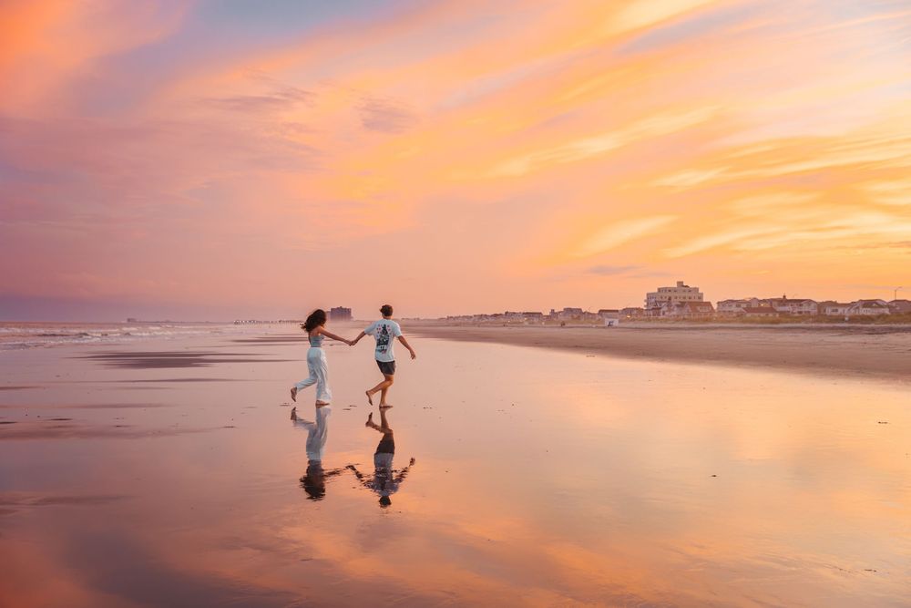 Couple running into the sunset