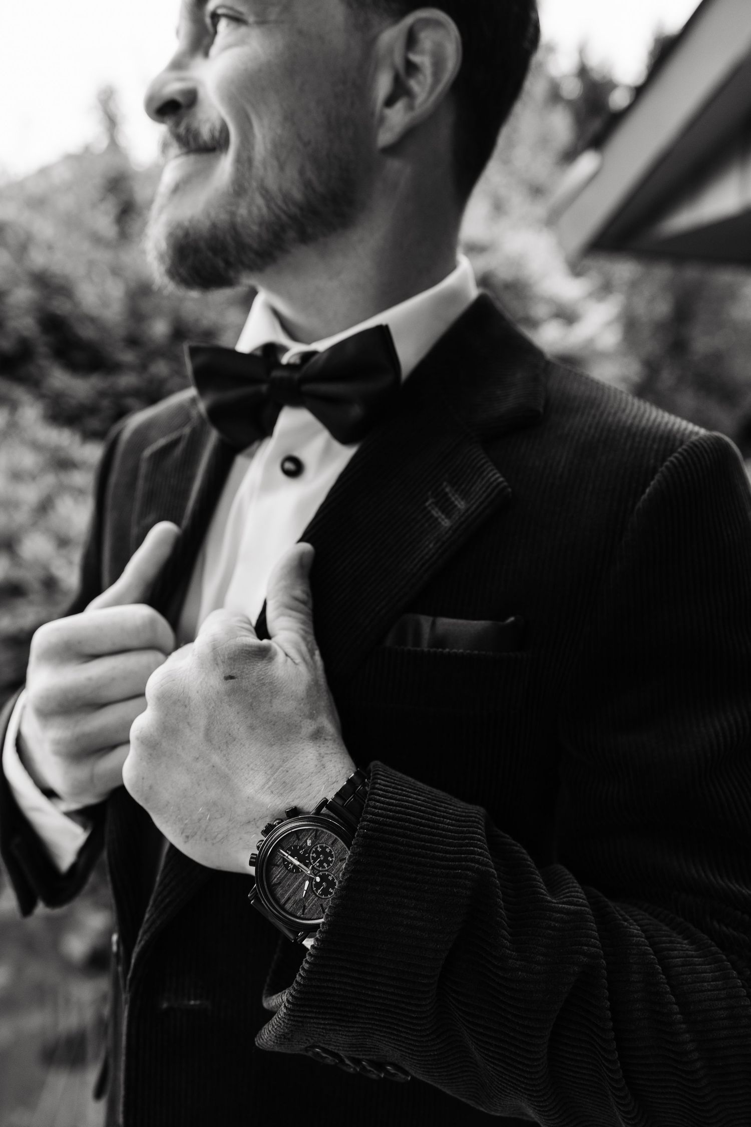 Black and white close-up images showing details of a formal tuxedo with bowtie and wristwatch.