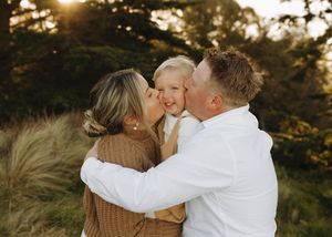 A group of romantic engagement photos taken at golden sunset with couples embracing in white and brown attire.