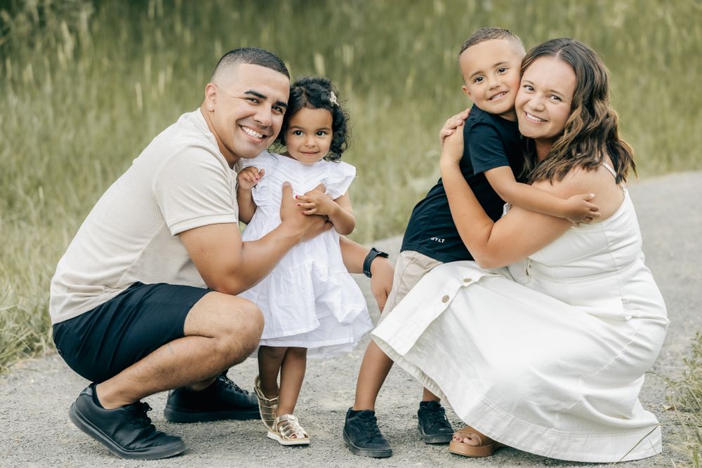 professional colorado family photo session in rocky mountains family of 4 posing in the mountains during sunset golden hour time. liz rivas