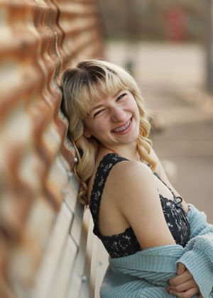 A sequence of casual portraits featuring someone in a blue sweater and black top with a warm expression.