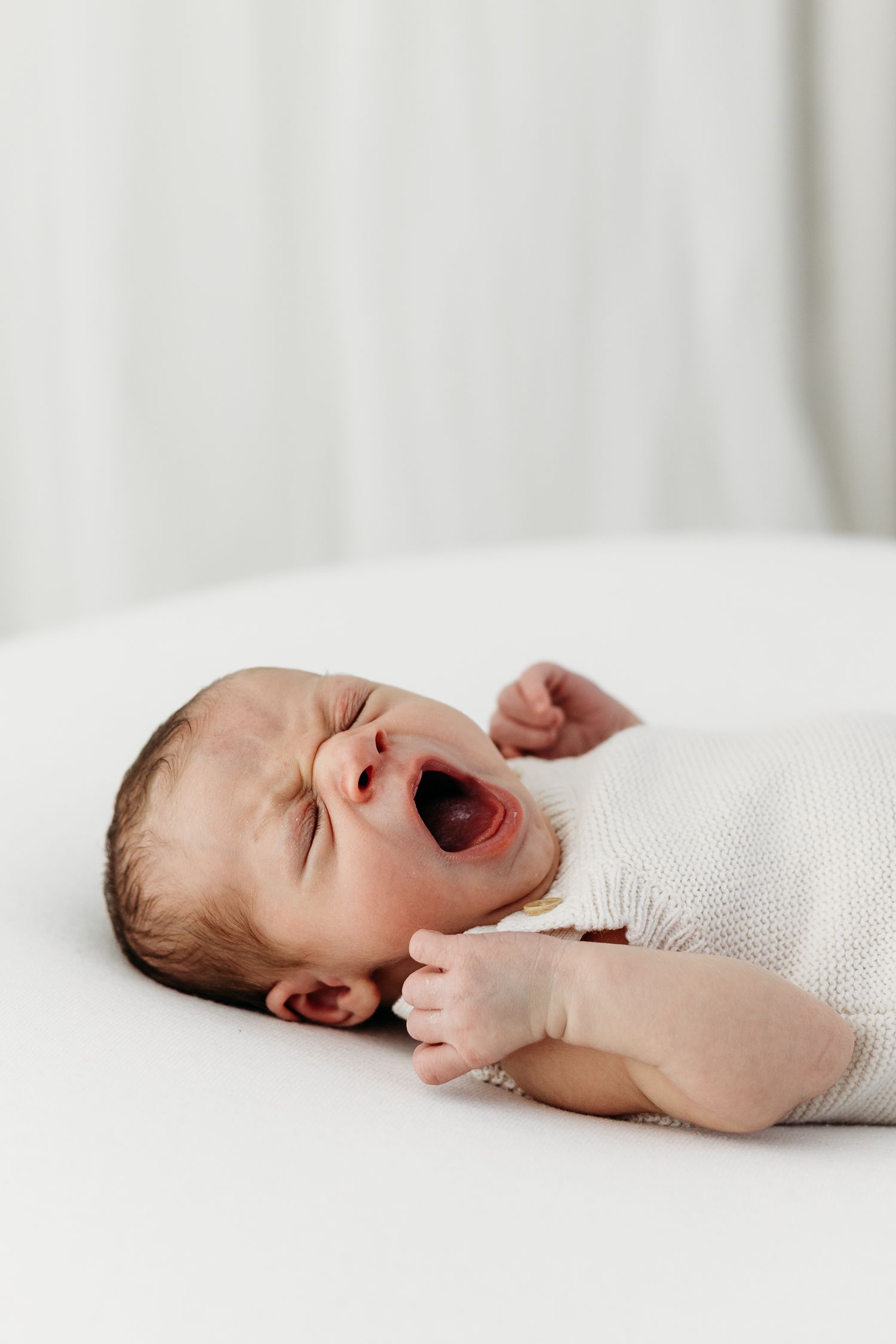 Nottingham newborn photographer capturing peaceful baby portraits in Mapperley studio with calm, timeless tones.