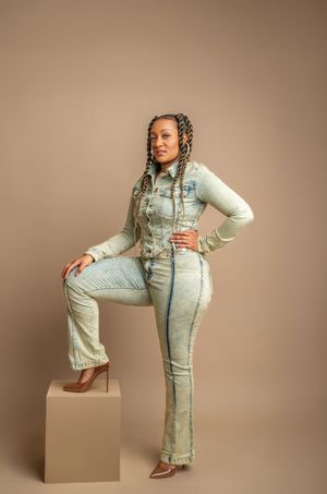 Model wearing light blue denim overalls and cream sweater poses in various stances against neutral studio backdrop.