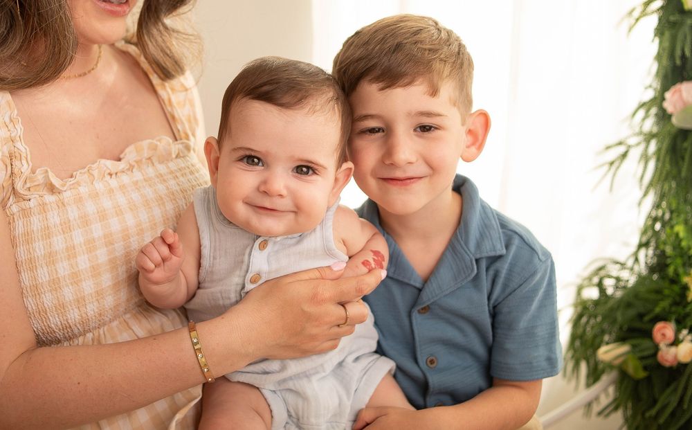 Smiling baby photographed during a milestone session in Central Louisiana.