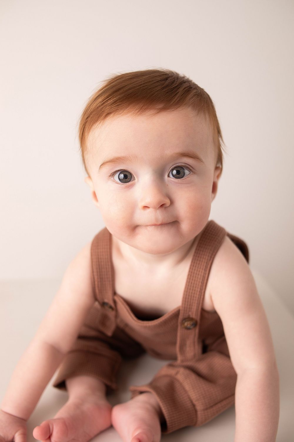 Baby milestone portrait photographed in a Central Louisiana studio.