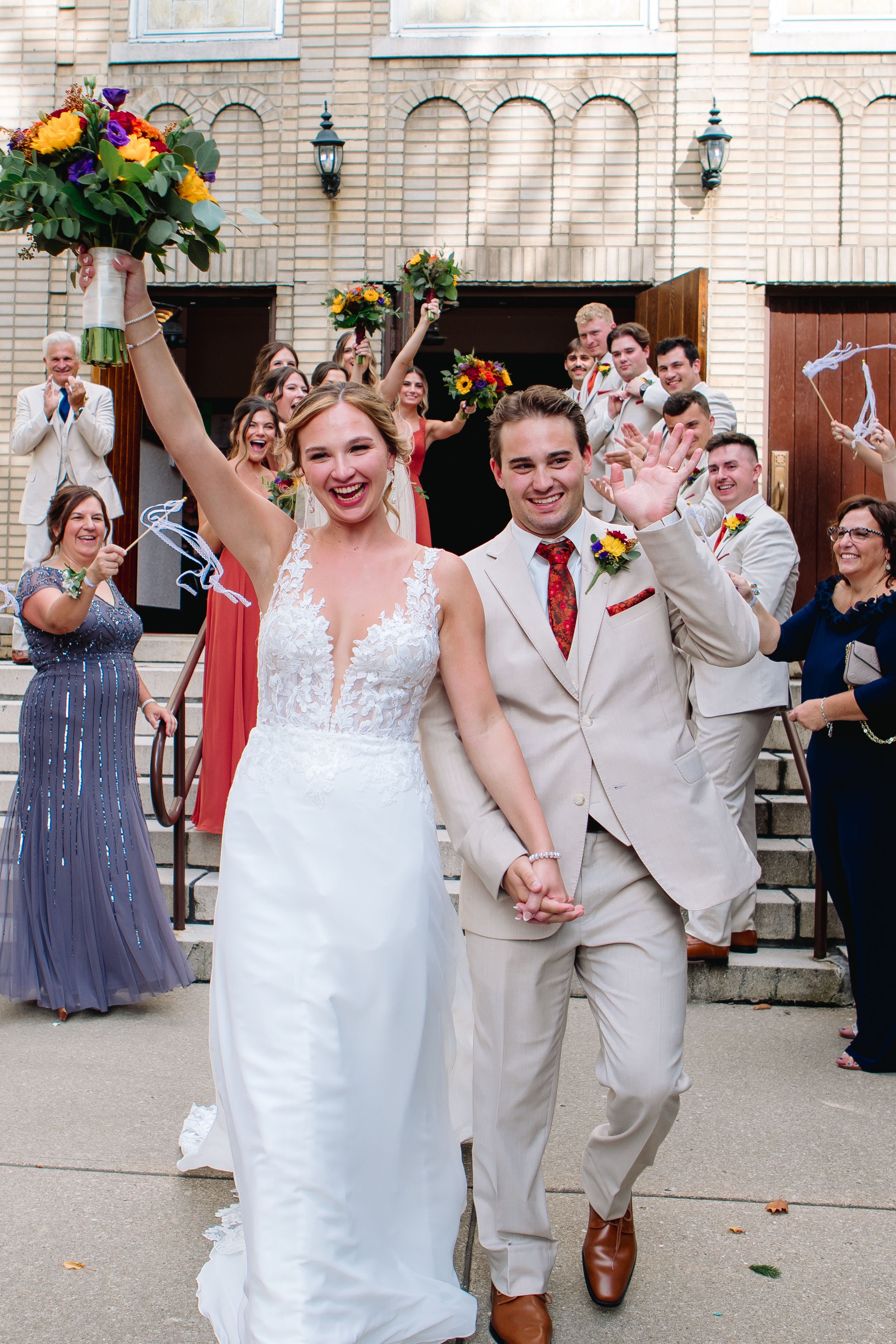 Buffalo Wedding Photographer Jess Trankle Images Photographs The bride and Groom for their grand exit at St. Joseph's Church in Buffalo, NY