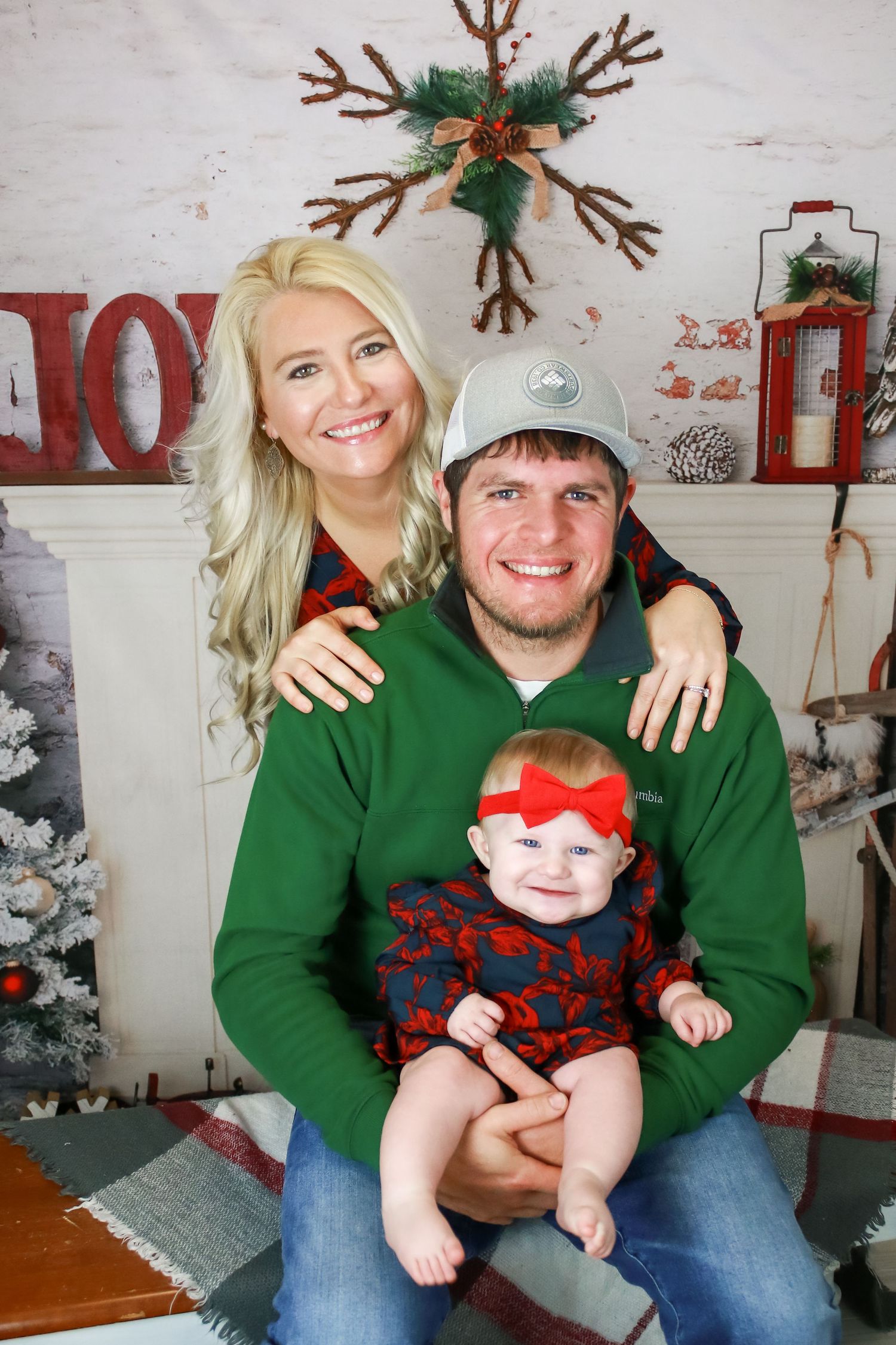 Family holiday photos with Christmas decorations and festive green sweaters.