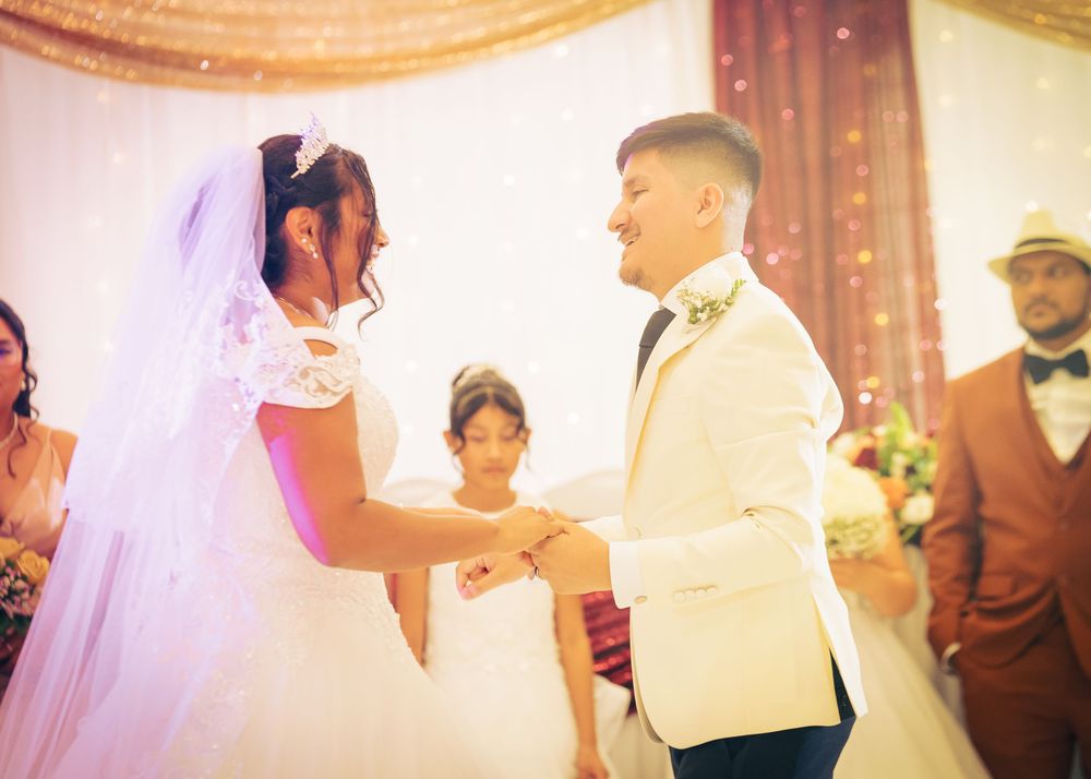 Latinx wedding reception bride and groom dance