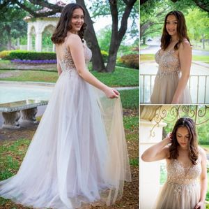 A dreamy outdoor photoshoot featuring an elegant white tulle gown with sparkly details in a garden setting.