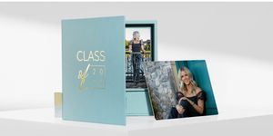 A collection of business cards and marketing materials in soft teal and white colors displayed on a light surface.