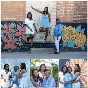 A group of friends in coordinating white and denim outfits pose together against a colorful mural wall.