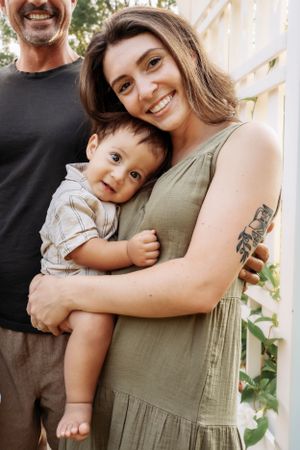 Parent and child share tender embraces in a series of candid outdoor portraits.