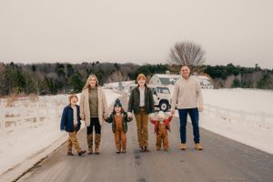 Group walking together on a snow-covered path during winter.