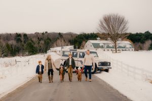 Winter family photography session on a snow-covered landscape.