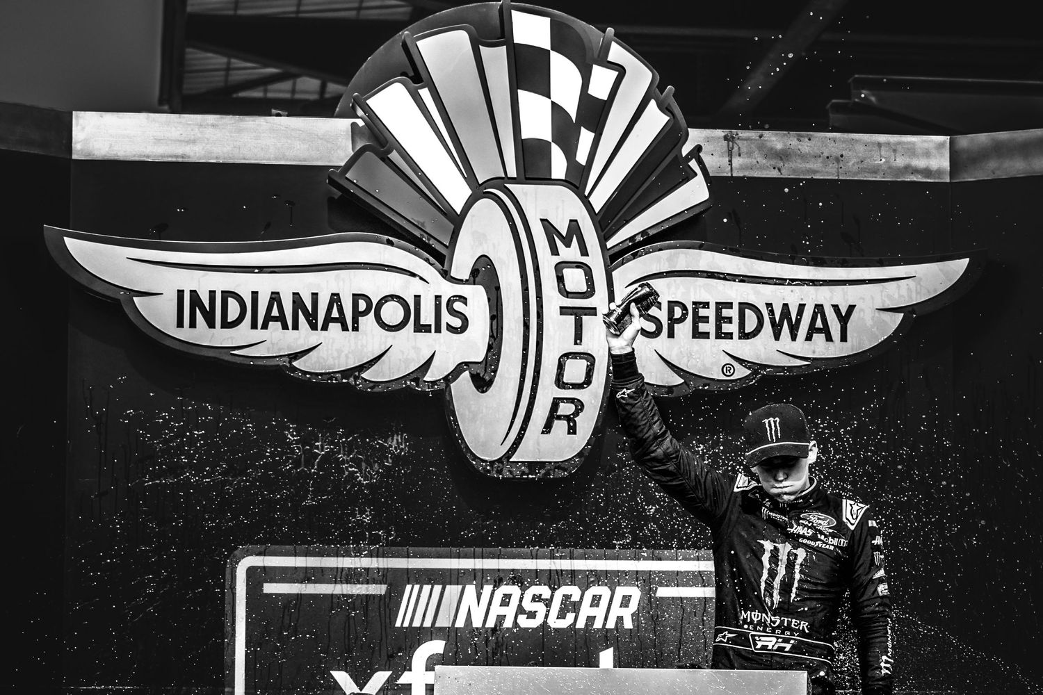 NASCAR and Indianapolis Motor Speedway logos displayed against a dark background.
