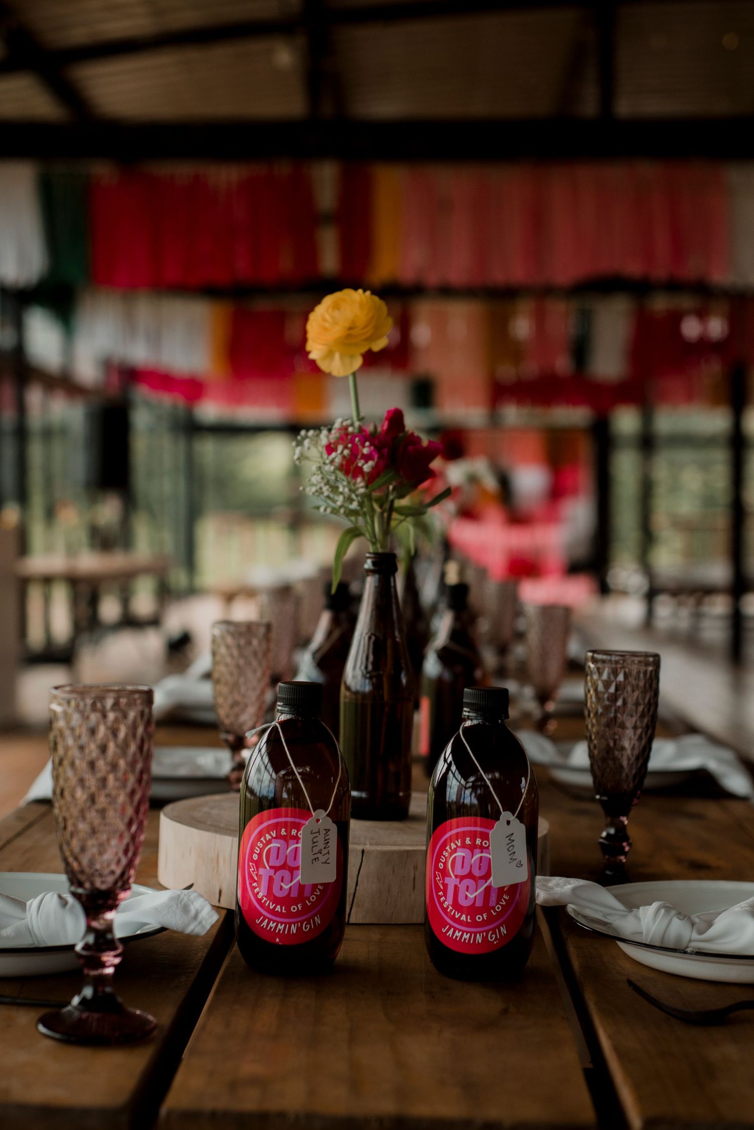 A vibrant pink festival setup with thoughtful homemade drinks for every guest, bringing color and joy to the celebration.
