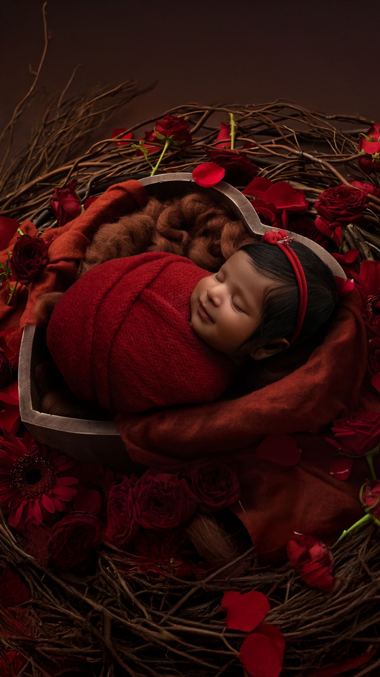 Curled-up 10-day-old newborn boy photographed in cosy studio setup in Hayes