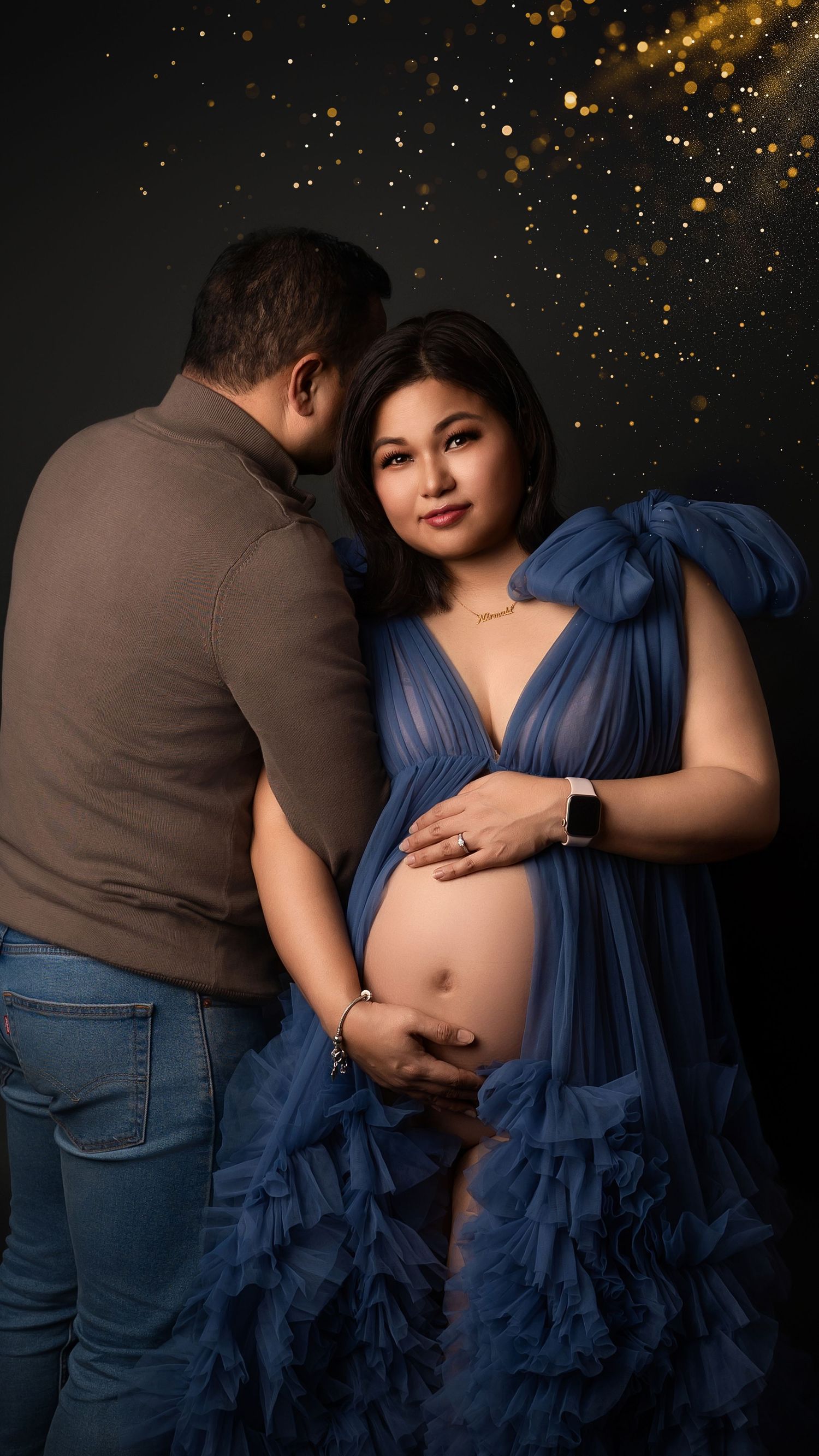 Expectant mother and partner during romantic maternity photoshoot in West London studio
