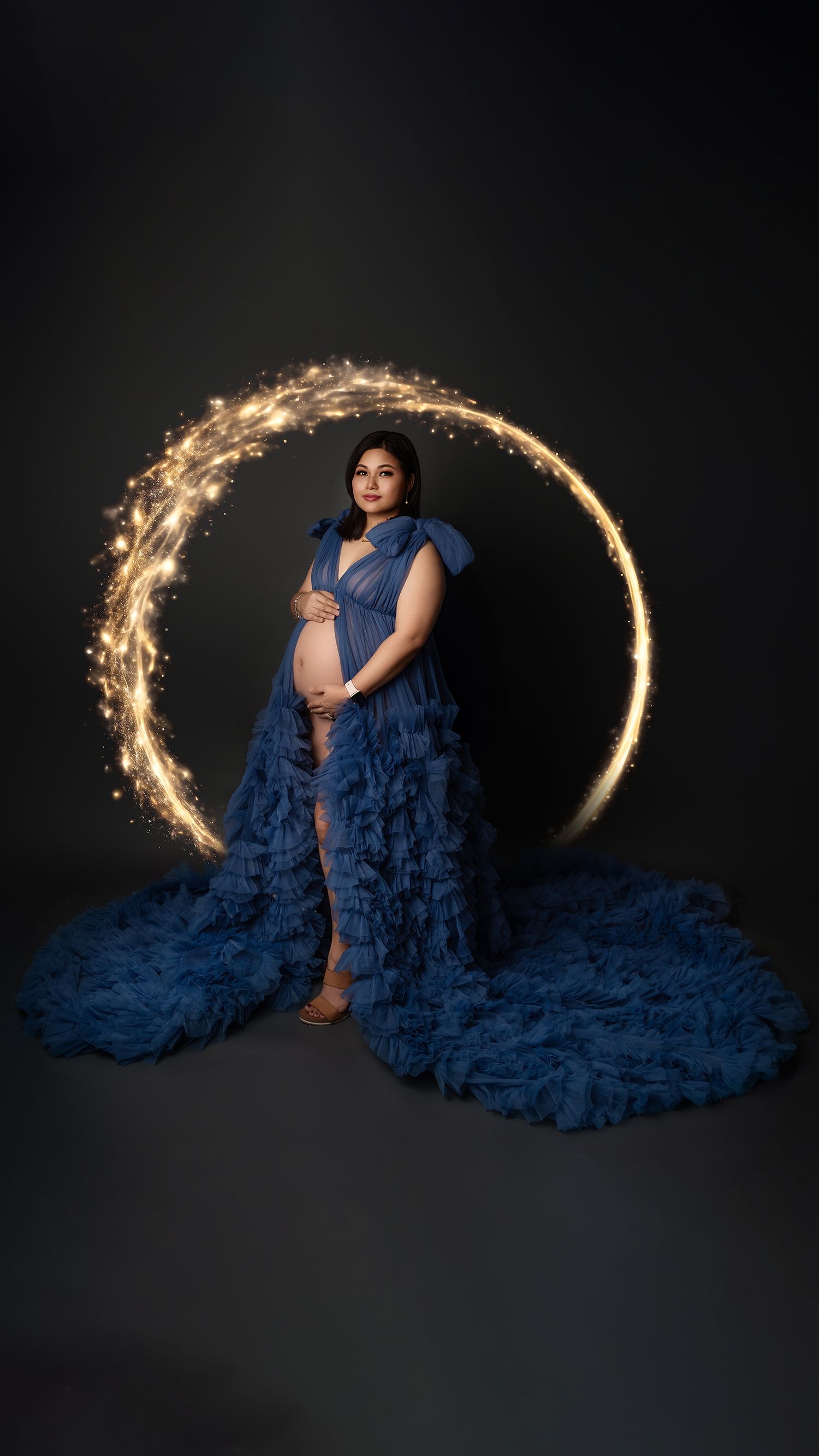 Mother-to-be posing in beautiful dress for professional maternity photography session in Hayes