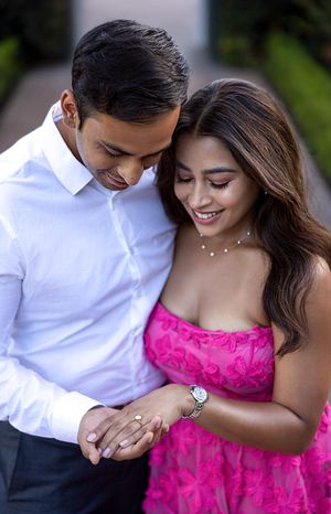 Engaged girl leans into fiancé