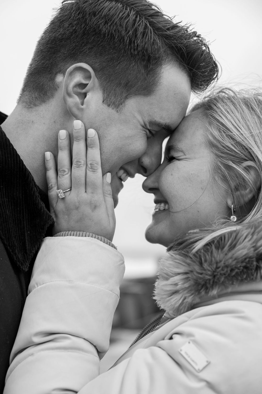 Black and white photo series showing an intimate romantic moment between a couple.