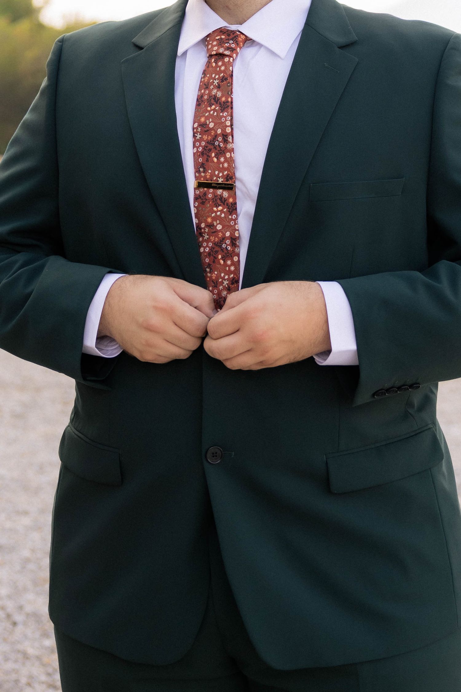 Groom getting ready photos outside in Springfield, Illinois