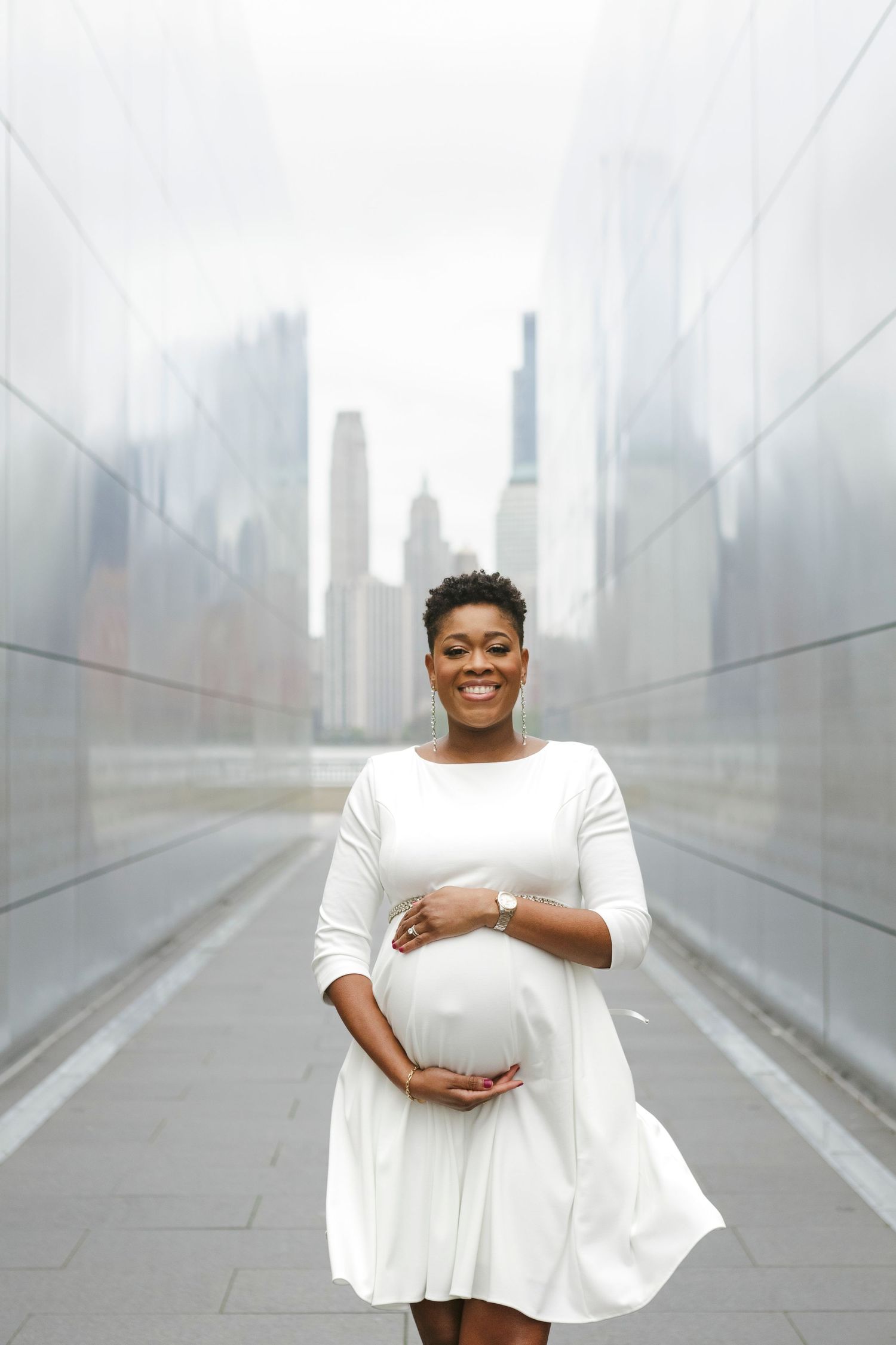 Mom-to-be in white dress at Liberty Park, Jersey City by Paula Ortiz Photography