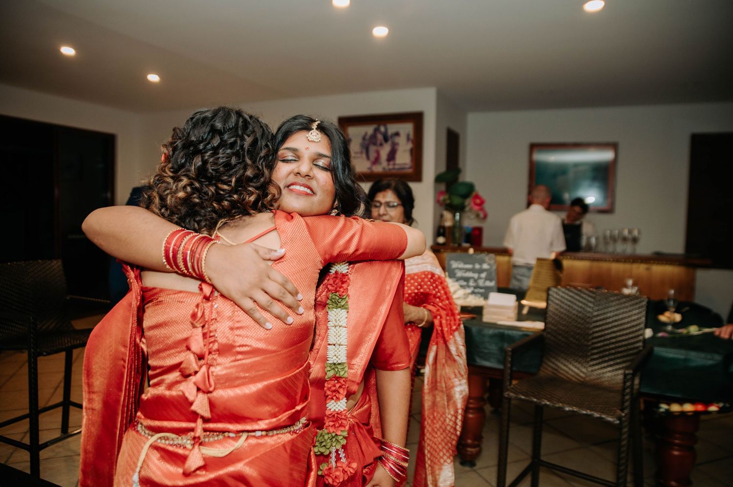 An emotional embrace during a wedding celebration.
