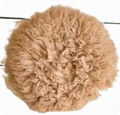 Tan colored fluffy textile material shown in progressive size reduction from left to right.
