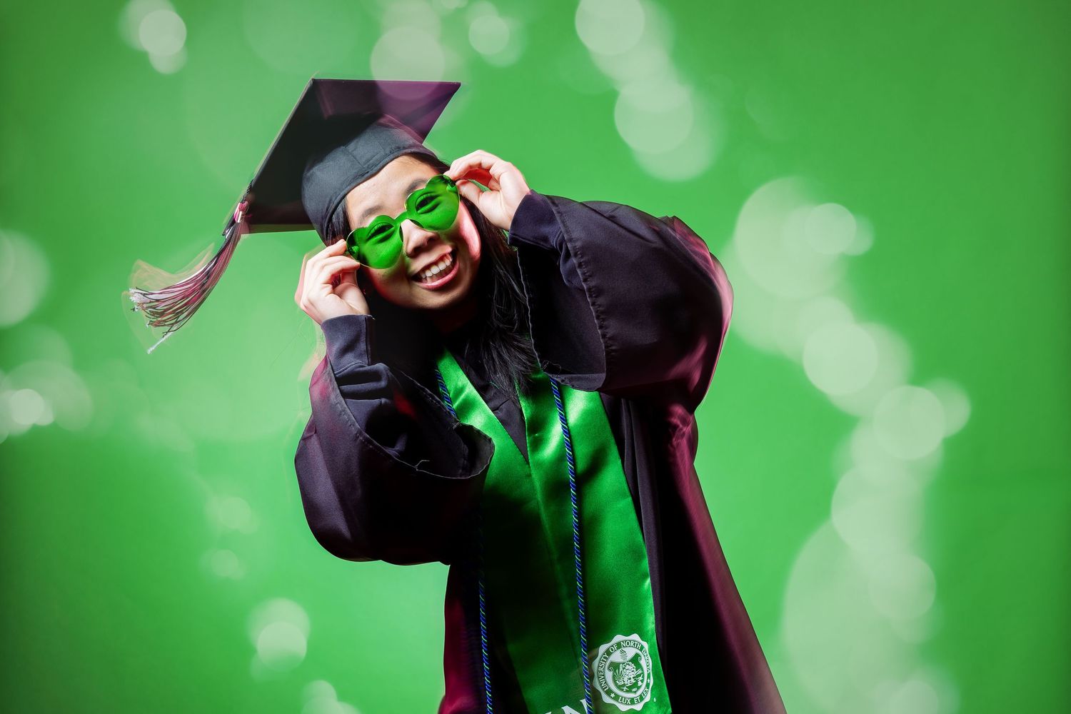 Dance performance against bright green screen background with dramatic lighting effects.