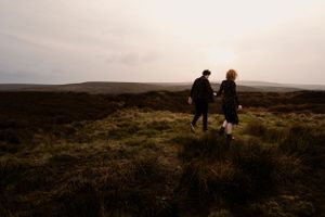 A couple wanders through the moorlands at sunset—an intimate and cinematic capture of love and adventure. Engagement, Elopement