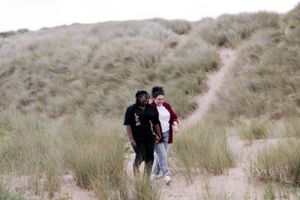 A tender moment captured in the dunes — a soft, timeless and intimate. LGBTQ+ engagement