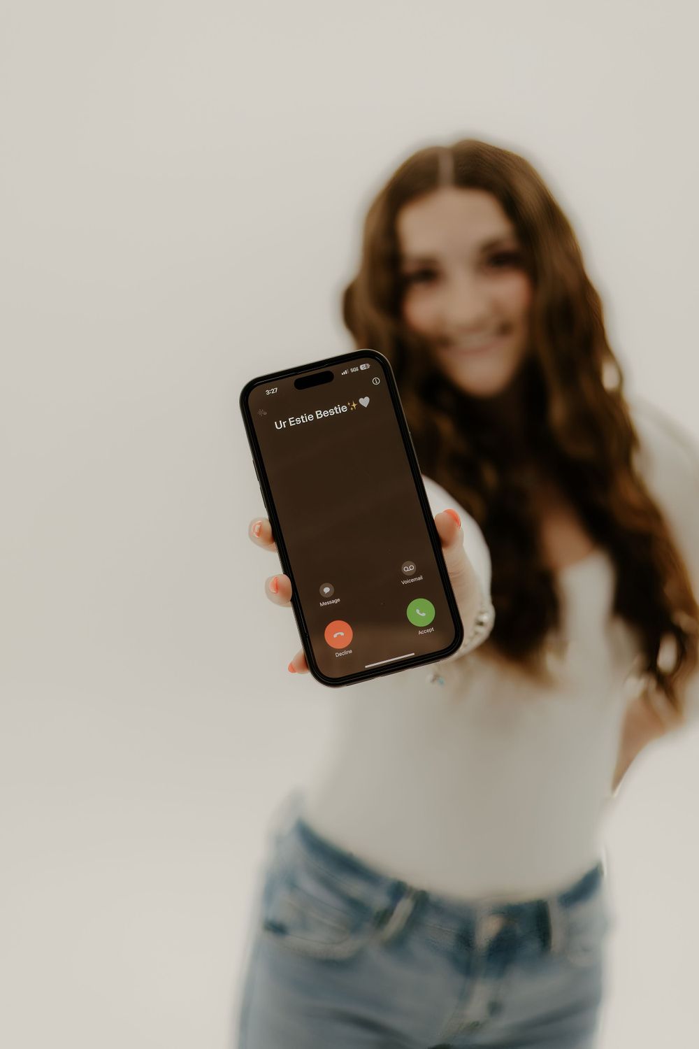 Stylish portrait showing smartphone screen with incoming call notification.