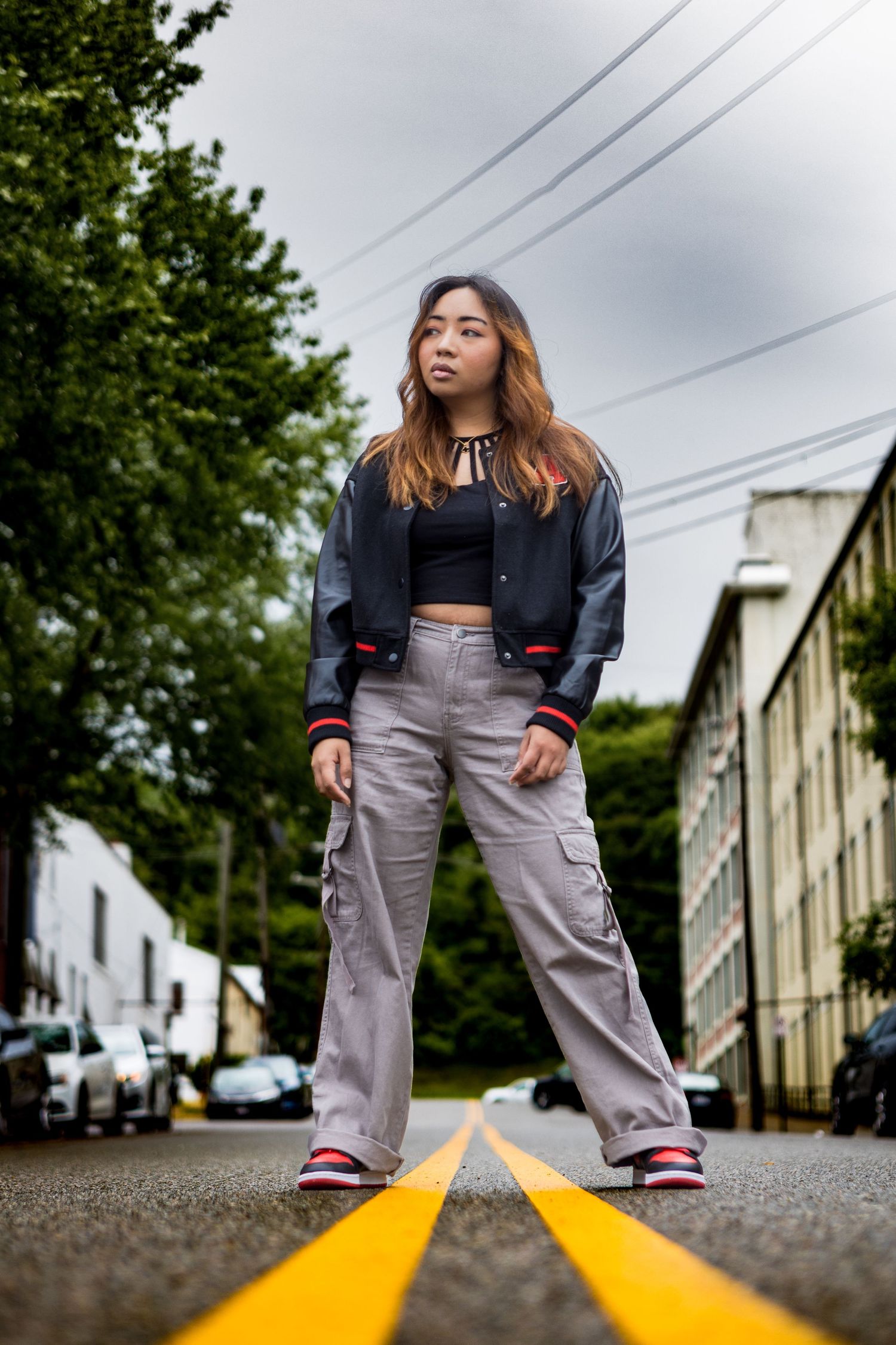 Street style portrait taken of woman standing in the street in Richmond Virginia by Chris Suits Photography
