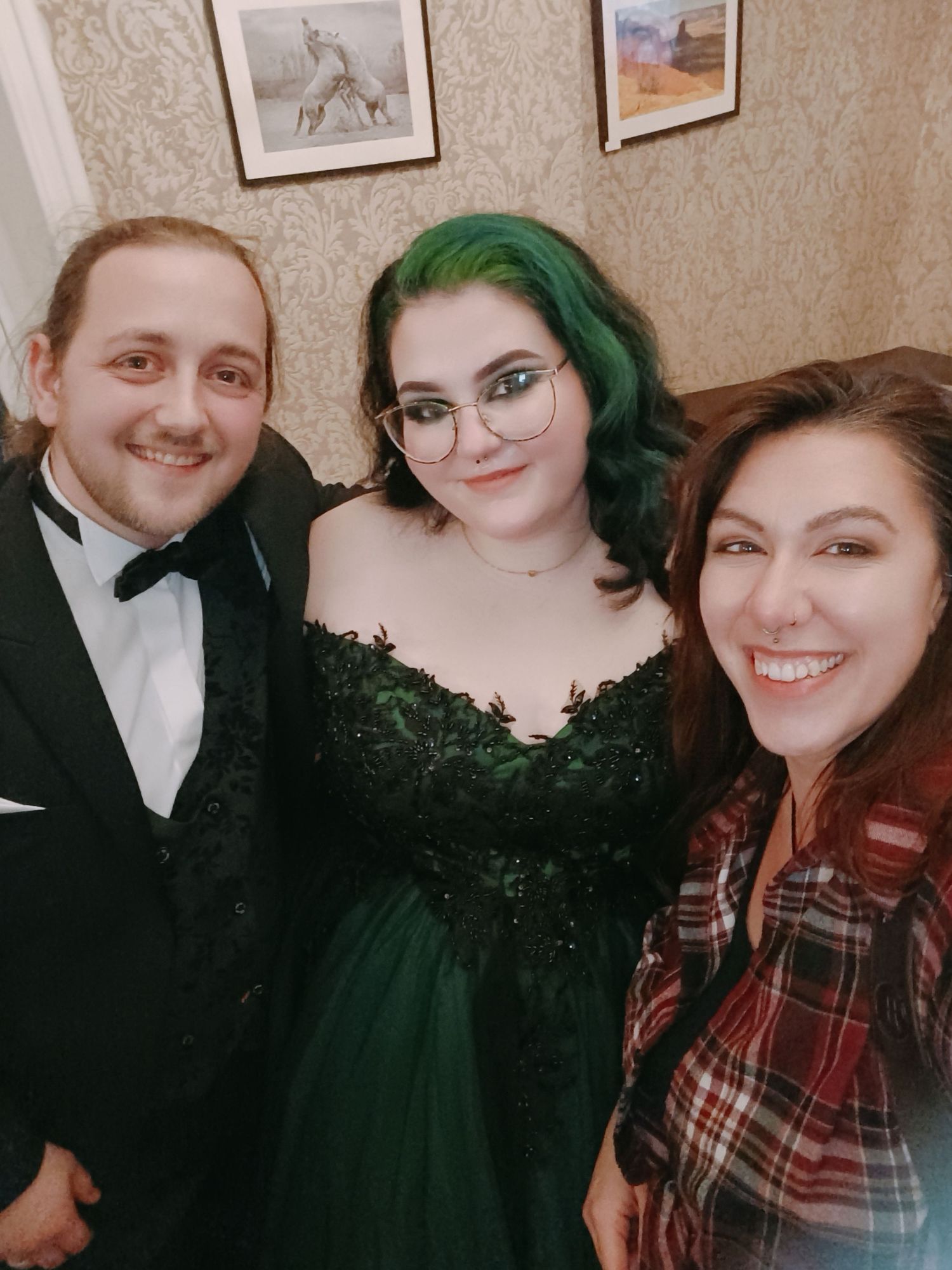 Group photo of friends in formal attire at an elegant event.