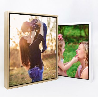 Two framed canvas prints displaying family photos with natural lighting effects.